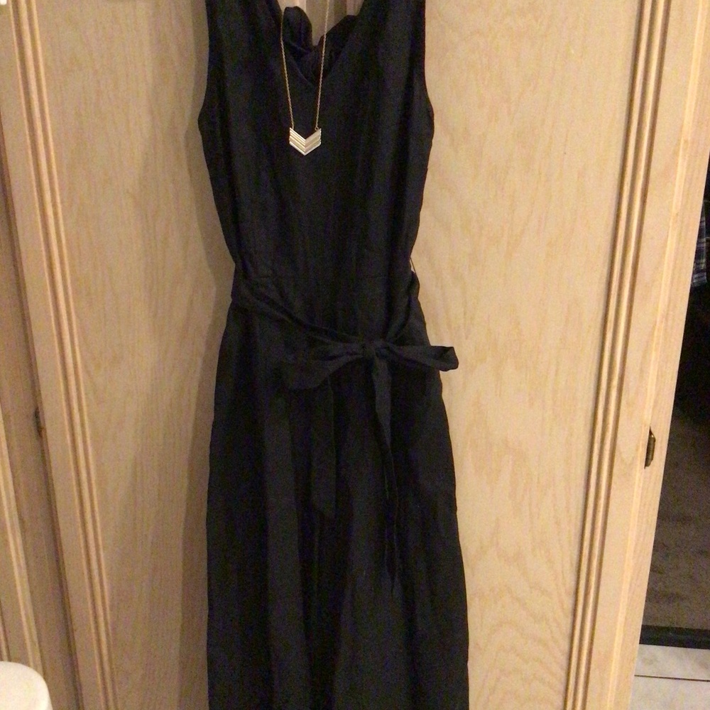 Black jumpsuit with necklace
